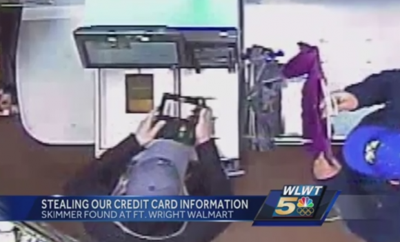 Footage of crooks installing the card skimmers at a Walmart self-checkout terminal. Source: WLWT.
