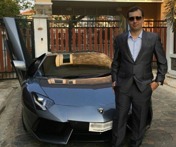 Alexandre Cazes, standing in front of one of four Lamborghini sports cars he owned. Image: Hanke.io.