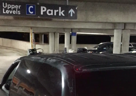 A van at Reagan National Airport equipped with automated license plate readers fixed to the roof.